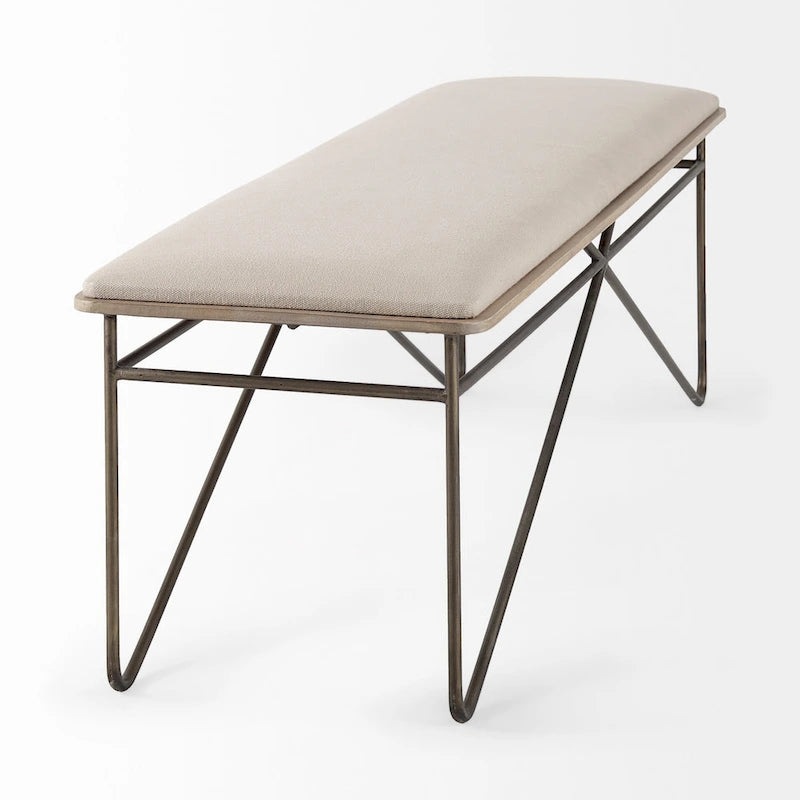 Banc Camille avec assise en tissu crème et structure en métal foncé – 55,5 larg. x 16 prof. x 17 haut.