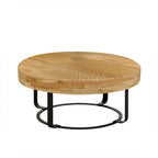 Table basse ronde moderne en bois sculpté avec pieds en métal